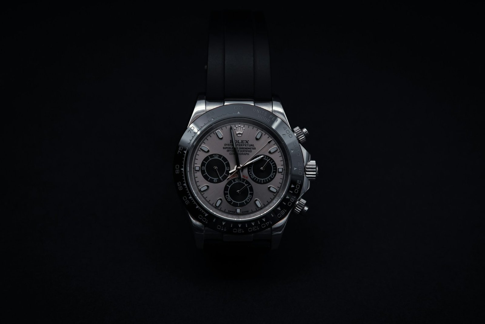 Silver chronograph in a soft spotlight on a black background